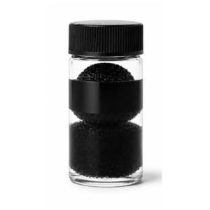 Black lash adhesive mixing beads in clear container