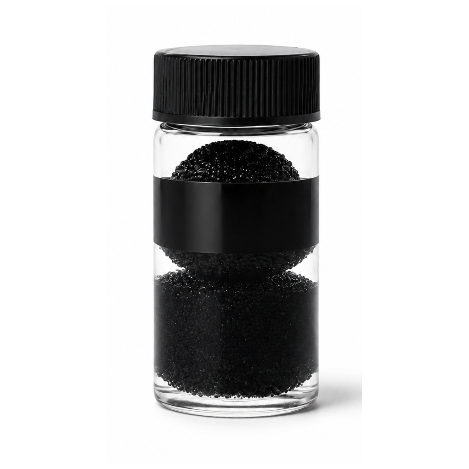 Black lash adhesive mixing beads in clear container